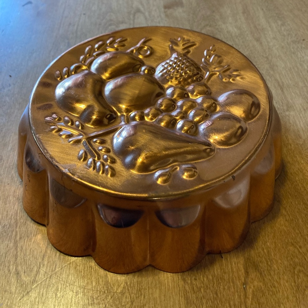 Vintage copper mold with fruit